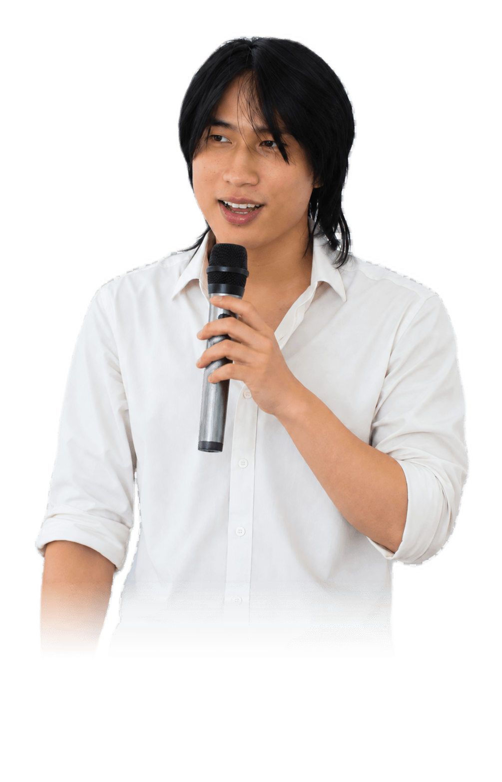 Buta speaking about AI systems while holding a microphone